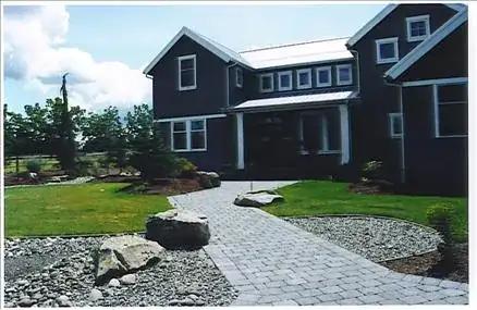 a dry well to drain a front yard that used to be a mucky mess